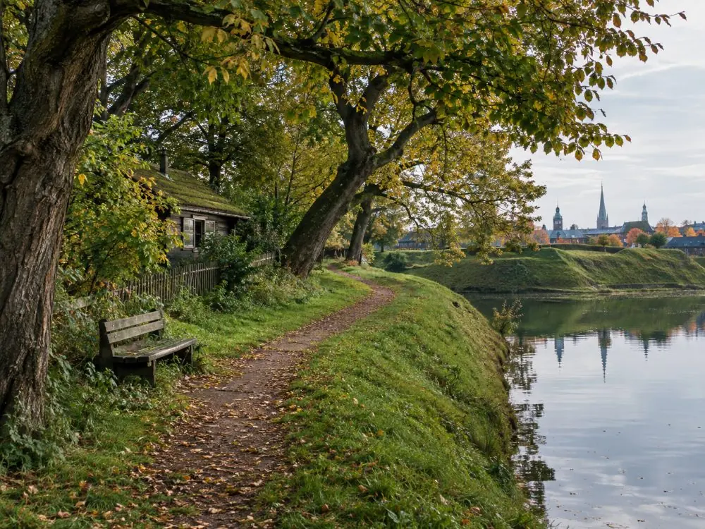 The old defensive ramparts and the lake in the green half of Christiania